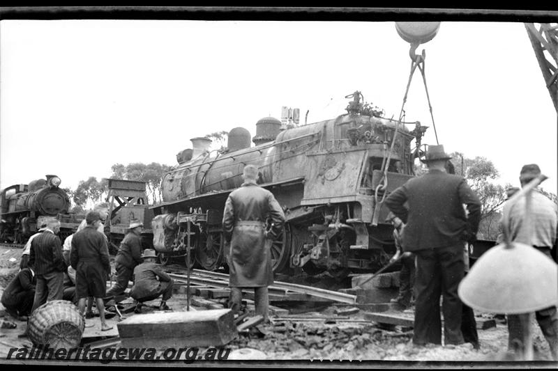 P21494
P class 444 loco, derailed on the Albany Express near Highbury, GSR line, , being lifted by railway crane, another steam loco, workers, onlookers,  portable oxyacetylene floodlight in the foreground, close up side and rear view. Date of derailment 23/1/1939
