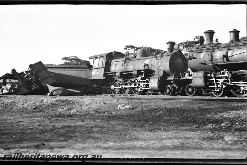 P21495
Head on collision at Mount Kokeby 1 of 3, ES class 354 loco and FS class 279 loco nose to nose, tender derailed, wreckage of wagons, Mount Kokeby, GSR line, side view from track level
