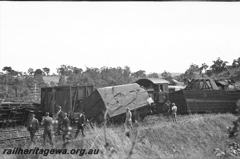 P21500
Swan View accident 3 of 5, wreckage of wagons and vans, steam loco (mostly obscured), workers, suited men, track, Swan View, ER line

