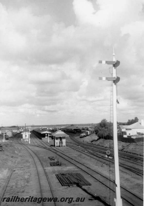 P21704
Signal box, signals, platforms, canopies, station buildings, sidings, pointwork, yard, Kalgoorlie, EGR line, view of eastern end of station
