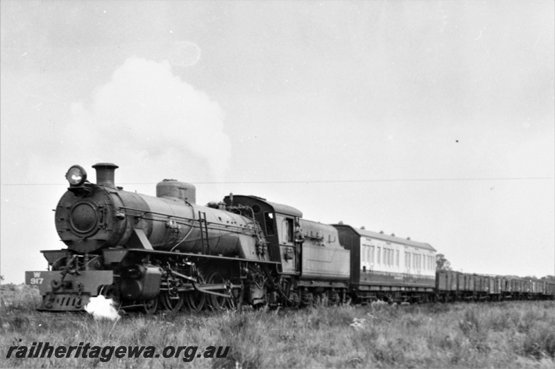 P21933
W class 917 narrow gauge steam locomotive with a goods train. ALT class 88 Track Recorder Car is attached behind the locomotive. Front and side view of locomotive. Same as P10543
