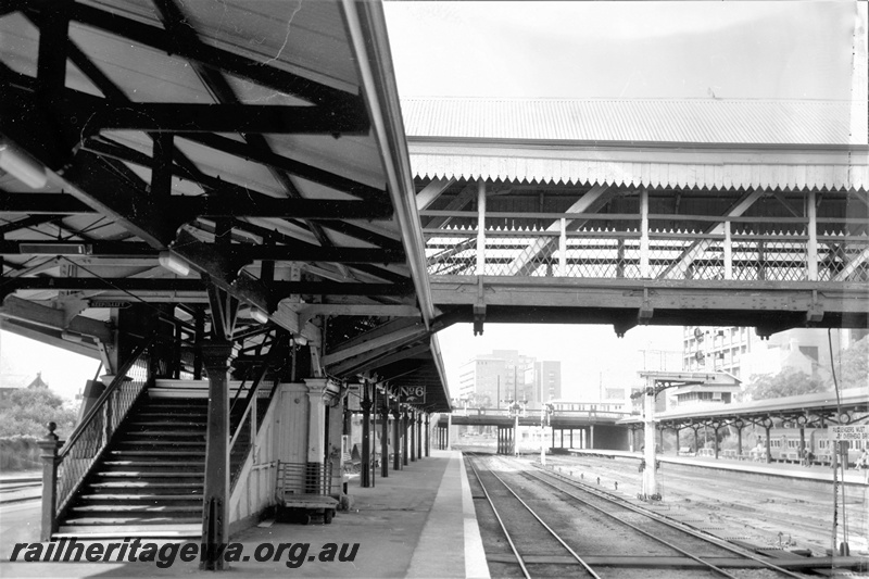 P21939
Overhead footbridge, platforms 6 and 4, canopies, stairs onto platform, bracket signals, tracks, Barrack Street road bridge, Perth station, view from platform
