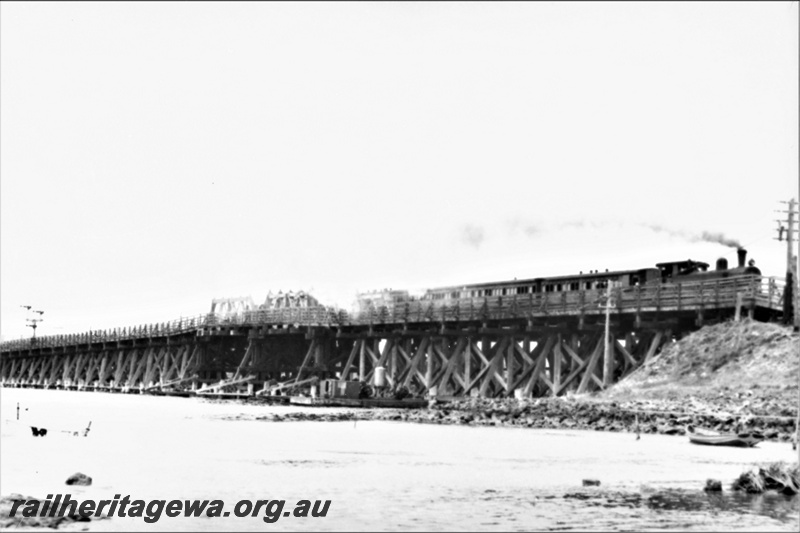 P21940
N class loco, on mixed, crossing, wooden trestle bridge, bracket signals, Swan River, Fremantle, ER line, side and front view from bank
