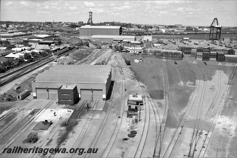 P21943
Loco yard, shed, fuel tanks, containers, port in background, cranes, North Fremantle, ER line, elevated view from light tower
