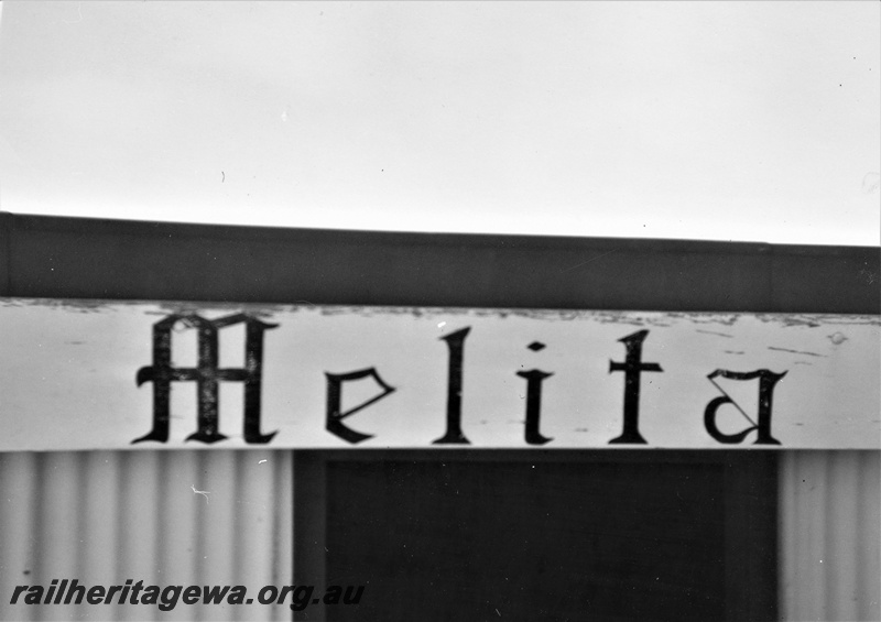 P21997
Nameboard, Melita, KL line, mounted on the front fascia of the shelter shed, unusual font employed
