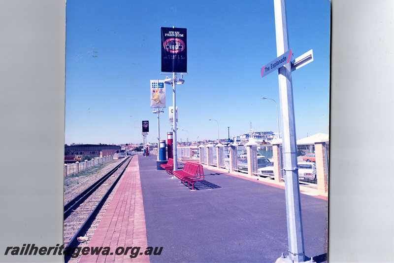 P22158
Platform, seats, fencing, advertising standards for the 1987 America's Cup Defence, platform name sign, dual gauge track, The Esplanade, FA line, view from platform
