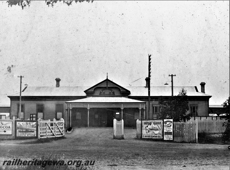P22160
Station building, weatherboard and metal, picket fence, Midland Junction, ER line, view from road, c1900

