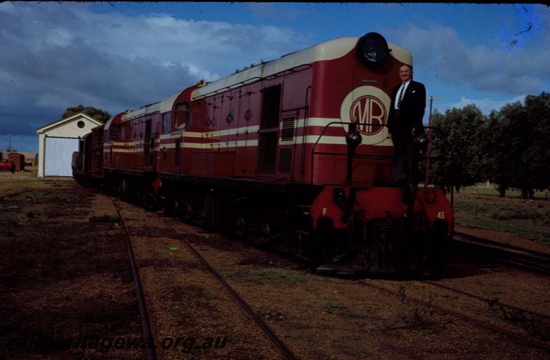 T00102
MRWA F class 45 in MRWA livery, goods shed, Walkaway?, W line, double headed, side and font view, Commissioner of Railways Mr. C. G. C. Wayne on loco
