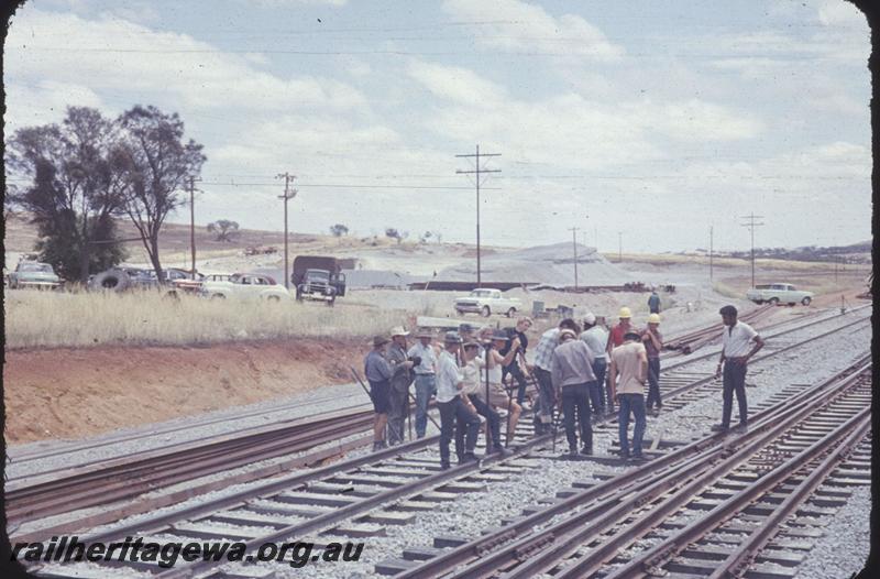 T01774
Standard Gauge Project, tracklaying, workers standing around
