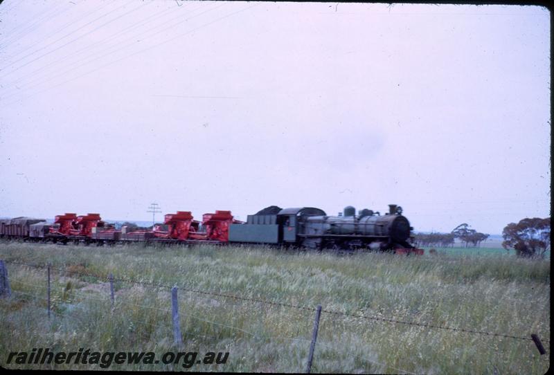 T03675
PM class loco, near Baandee, EGR line, goods train, agricultural machinery included in load
