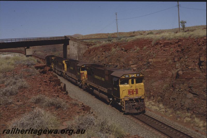 T04062
Hamersley Iron Alco CE636R class 4041 leads CE636R class 3008, and two other units, loaded train, passing under Robe River line, Western Creek, RIO line
