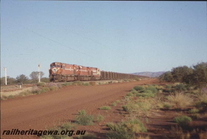 T04075
Mount Newman Mining triple headed loaded train, Alco loco M636 class 5504, 258.1km crossing, Gidgi, BHP line
