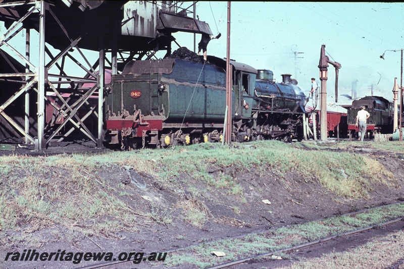 T04477
W class 942 steam locomotive being coaled at the Bunbury Locomotive Depot. Note the fireman on the tender. SWR line
