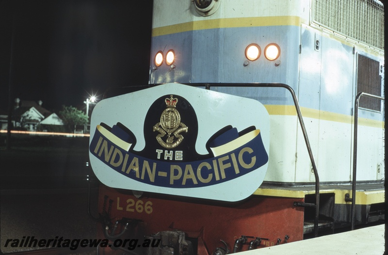 T04698
L class 266 standard gauge diesel locomotive at Perth Terminal with 'The Indian Pacific' headboard attached to the front handrails.
