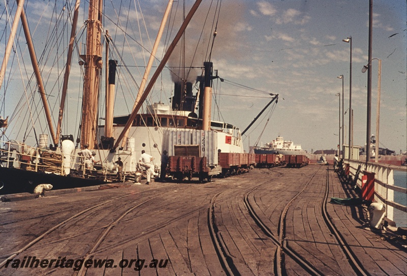 T04728
Port Hedland Jetty with a number of narrow gauge open wagons either being loaded or have been unloaded. Note the rails laid flushed with the jetty decking.
