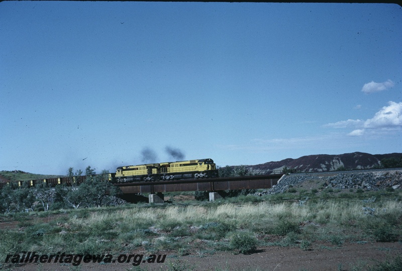 T04739
Cliffs Robe River (CRRIA) M636 class 1712 and M636 class 1710 crossing Miller Creek hauling an empty ore train to the Pannawonica mine. 
