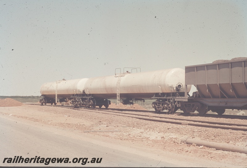 T04824
Goldsworthy Mining (GML) water tank cars at Finucane Island. They were used to provide fresh water to the Finucane Island port operations. The water was sourced from a bore near Goldsworthy.
