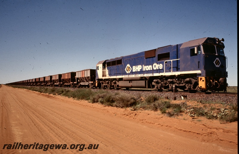 T04834
BHP Iron Ore (Goldsworthy Operations) GML 10 class (blue livery) hauling loaded iron ore train near Finucane Island
