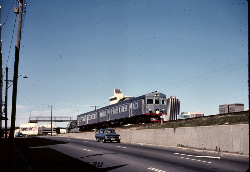 T04870
Two car DMU including ADK class 683, pedestrian overpass, road, West Perth, ER line. Second last day before 1979 closure of Fremantle line.
