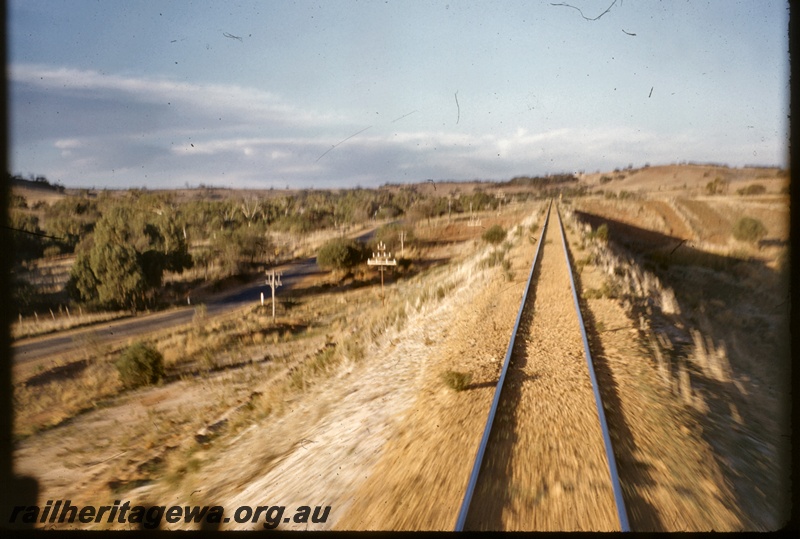 T04930
View of single line track, road running alongside, between Geraldton and Mullewa, NR line, view from diesel loco cab
