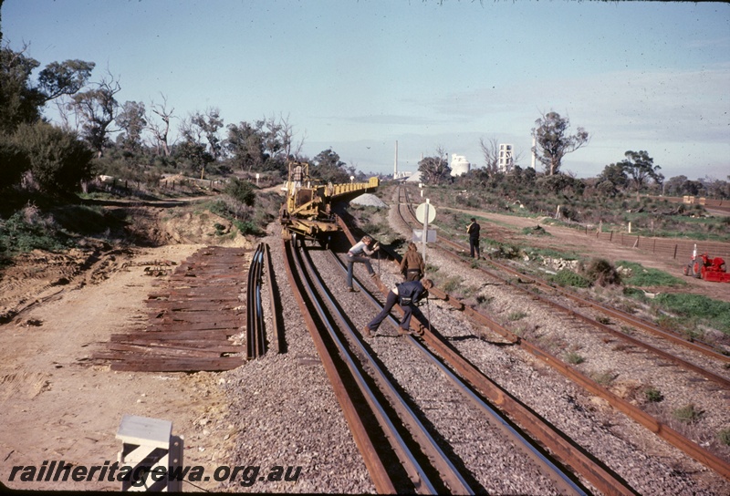 T05023
Track renewal, track laying machine, rail wagons, van, workers, Cockburn South, Kalgoorlie to Kwinana Rehabilitation Project
