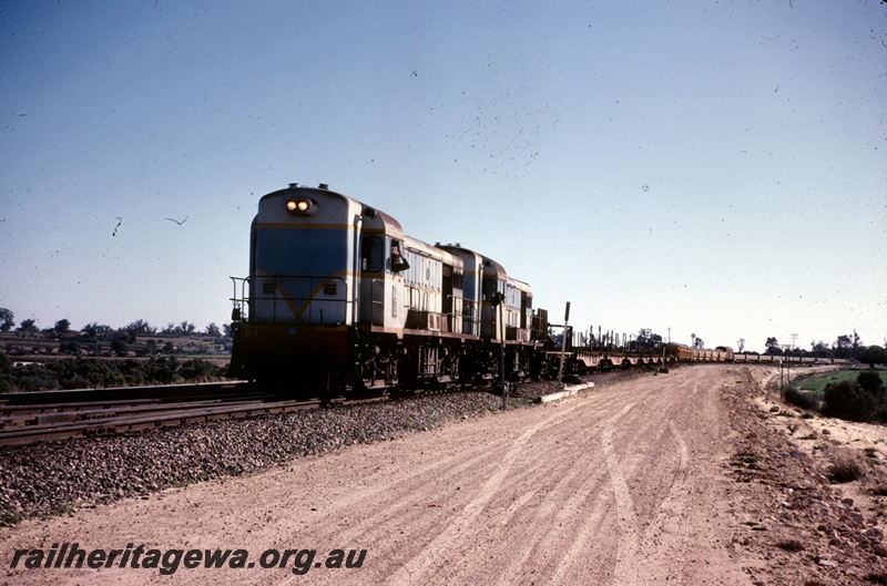 T05035
H class 1 and another H class diesel, on standard gauge work train, near Cockburn Junction, Kalgoorlie to Kwinana Rehabilitation Project, front and side view
