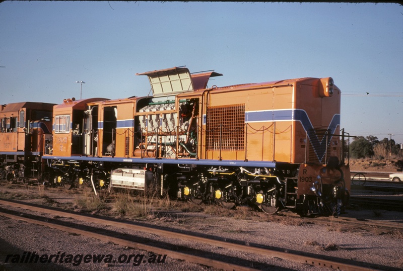 T05103
R class 1903, with side chains and engine panels raised, under test, N class 1871 (end only), Forrestfield, side and end view
