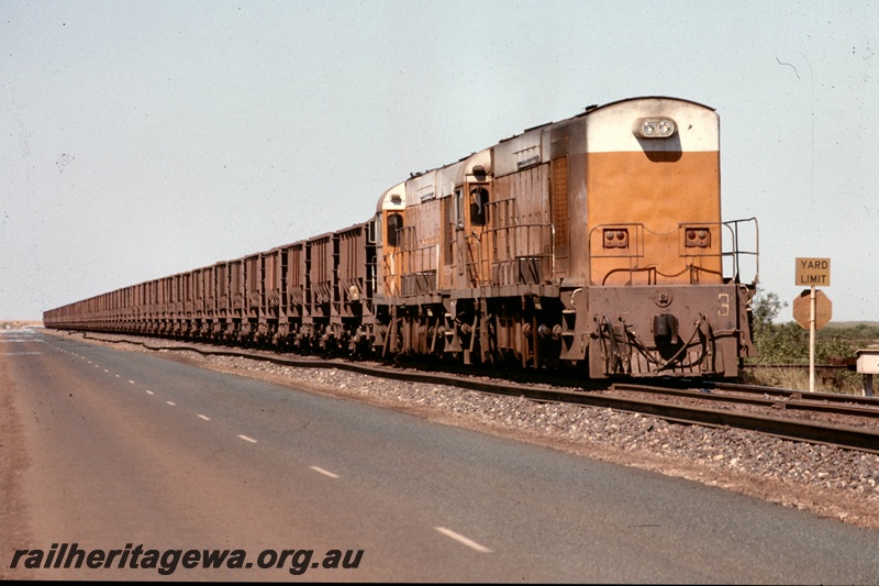T05194
Goldsworthy Mining (GML) A class 3 and unidentified A class loaded iron ore train at Finucane Island. 
