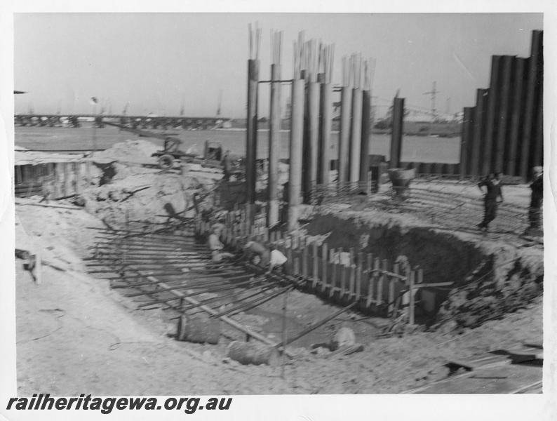 P00047
10 of 98 images showing views and aspects of the construction of the steel girder bridge with concrete pylons across the Swan River at North Fremantle.
