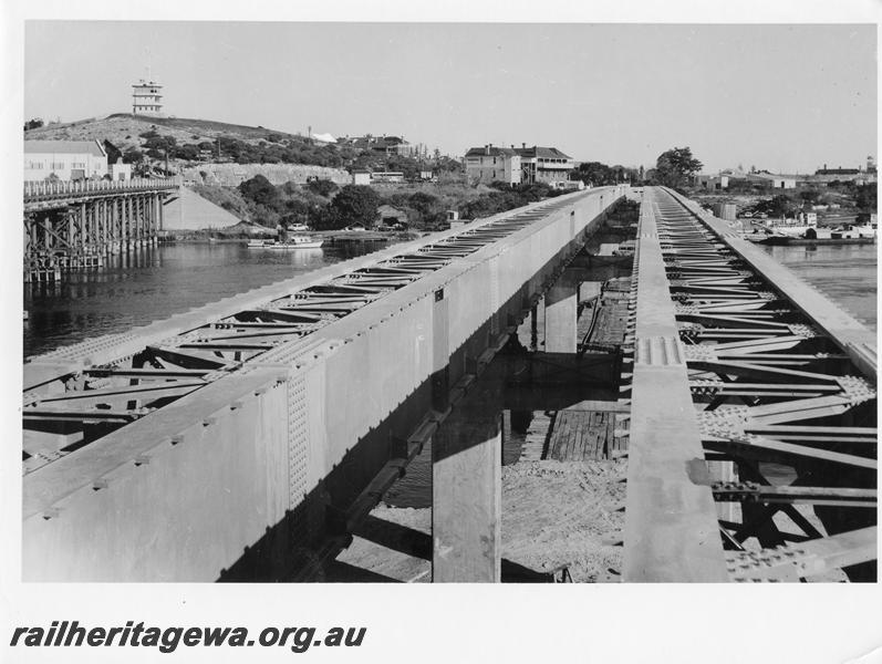 P00054
17 of 98 images showing views and aspects of the construction of the steel girder bridge with concrete pylons across the Swan River at North Fremantle.
