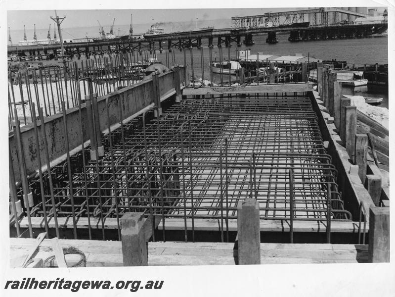 P00056
19 of 98 images showing views and aspects of the construction of the steel girder bridge with concrete pylons across the Swan River at North Fremantle.
