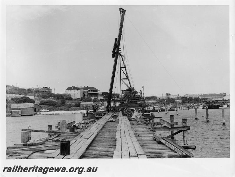 P00060
23 of 98 images showing views and aspects of the construction of the steel girder bridge with concrete pylons across the Swan River at North Fremantle.
