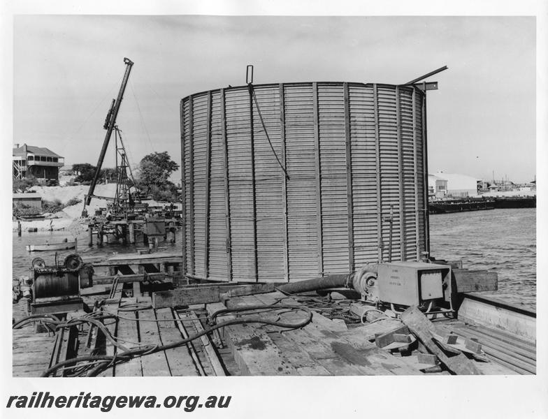 P00067
30 of 98 images showing views and aspects of the construction of the steel girder bridge with concrete pylons across the Swan River at North Fremantle.
