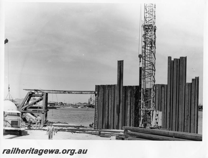 P00068
31 of 98 images showing views and aspects of the construction of the steel girder bridge with concrete pylons across the Swan River at North Fremantle.
