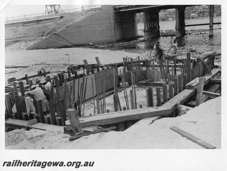 P00072
35 of 98 images showing views and aspects of the construction of the steel girder bridge with concrete pylons across the Swan River at North Fremantle.
