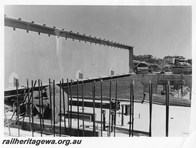 P00079
42 of 98 images showing views and aspects of the construction of the steel girder bridge with concrete pylons across the Swan River at North Fremantle.
