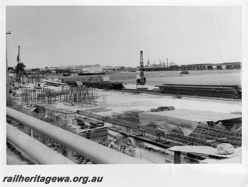 P00085
48 of 98 images showing views and aspects of the construction of the steel girder bridge with concrete pylons across the Swan River at North Fremantle.
