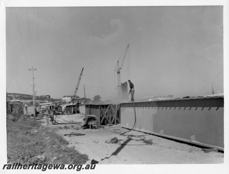 P00087
50 of 98 images showing views and aspects of the construction of the steel girder bridge with concrete pylons across the Swan River at North Fremantle.
