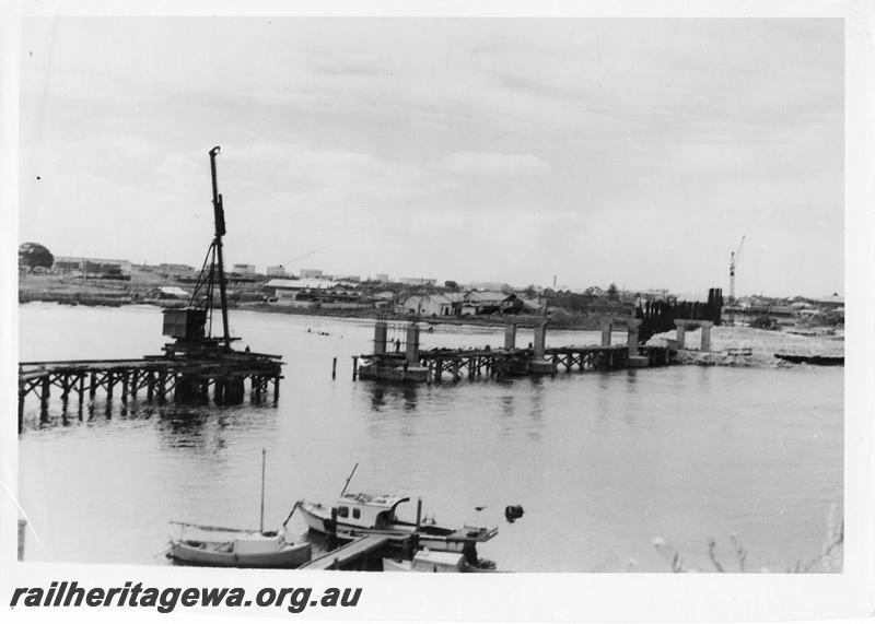 P00090
53 of 98 images showing views and aspects of the construction of the steel girder bridge with concrete pylons across the Swan River at North Fremantle.
