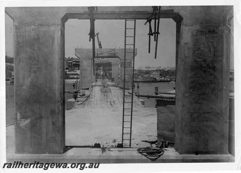 P00093
56 of 98 images showing views and aspects of the construction of the steel girder bridge with concrete pylons across the Swan River at North Fremantle.
