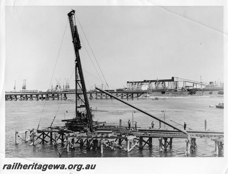 P00095
58 of 98 images showing views and aspects of the construction of the steel girder bridge with concrete pylons across the Swan River at North Fremantle.
