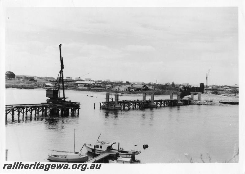 P00097
60 of 98 images showing views and aspects of the construction of the steel girder bridge with concrete pylons across the Swan River at North Fremantle.
