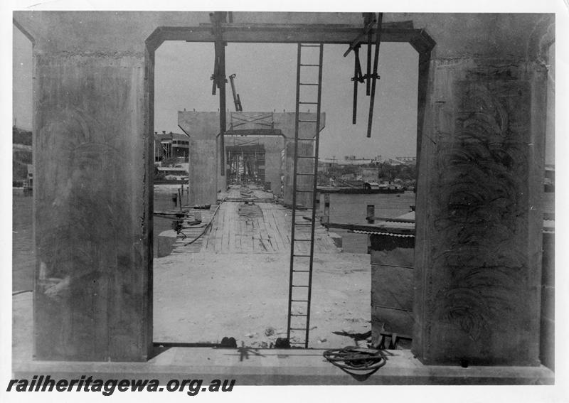 P00104
67 of 98 images showing views and aspects of the construction of the steel girder bridge with concrete pylons across the Swan River at North Fremantle.
