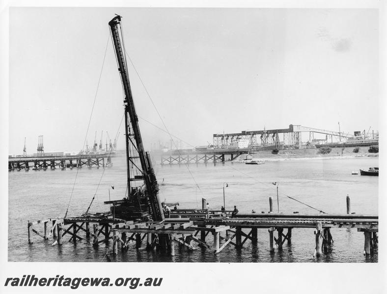 P00109
72 of 98 images showing views and aspects of the construction of the steel girder bridge with concrete pylons across the Swan River at North Fremantle.
