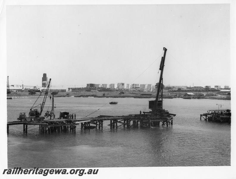 P00110
73 of 98 images showing views and aspects of the construction of the steel girder bridge with concrete pylons across the Swan River at North Fremantle.
