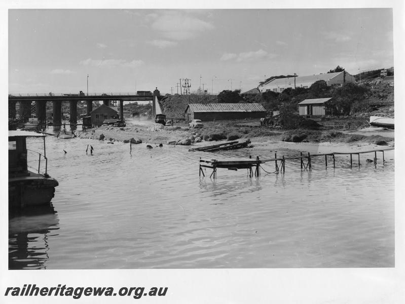 P00115
78 of 98 images showing views and aspects of the construction of the steel girder bridge with concrete pylons across the Swan River at North Fremantle.
