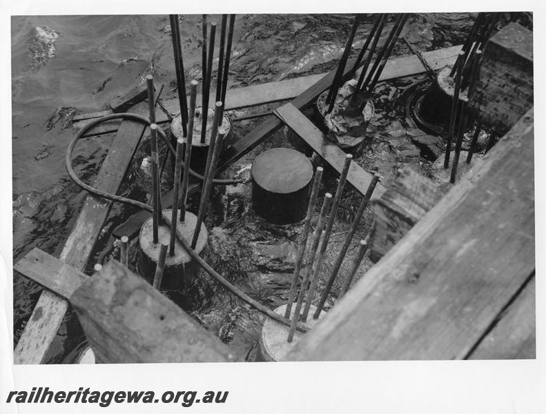 P00117
80 of 98 images showing views and aspects of the construction of the steel girder bridge with concrete pylons across the Swan River at North Fremantle.
