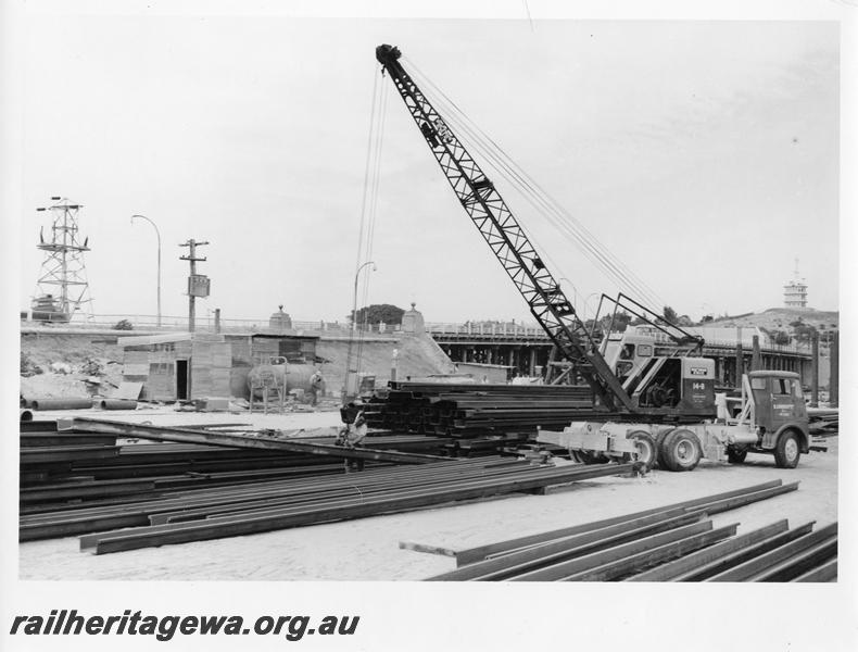 P00122
85 of 98 images showing views and aspects of the construction of the steel girder bridge with concrete pylons across the Swan River at North Fremantle.
