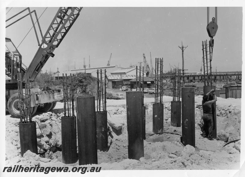 P00125
88 of 98 images showing views and aspects of the construction of the steel girder bridge with concrete pylons across the Swan River at North Fremantle.

