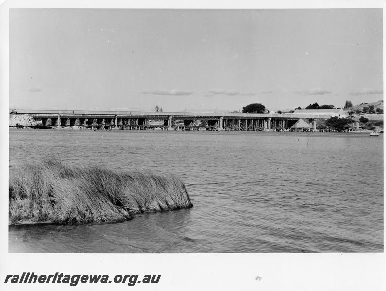 P00133
96 of 98 images showing views and aspects of the construction of the steel girder bridge with concrete pylons across the Swan River at North Fremantle.
